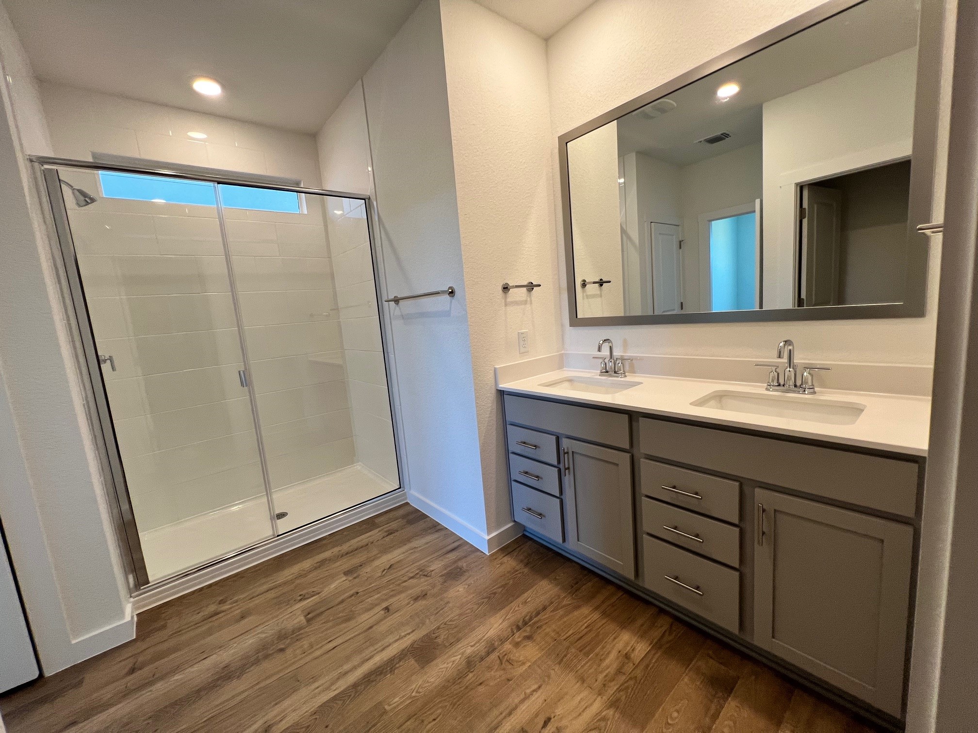 1917 Lazy Acrs Street Leander, TX 78641 - Photo 7 of 20 a bathroom with a double vanity sink and a mirror