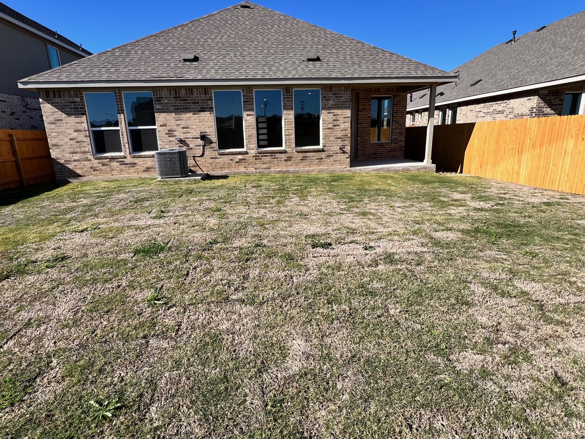 1917 Lazy Acrs Street Leander, TX 78641 - Photo 8 of 20 a house view with a sitting space and garden space