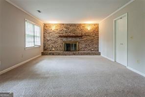 4722 Kenneth Drive Southwest Lilburn, GA 30047 - Photo 11 of 12 a view of empty room with a fireplace