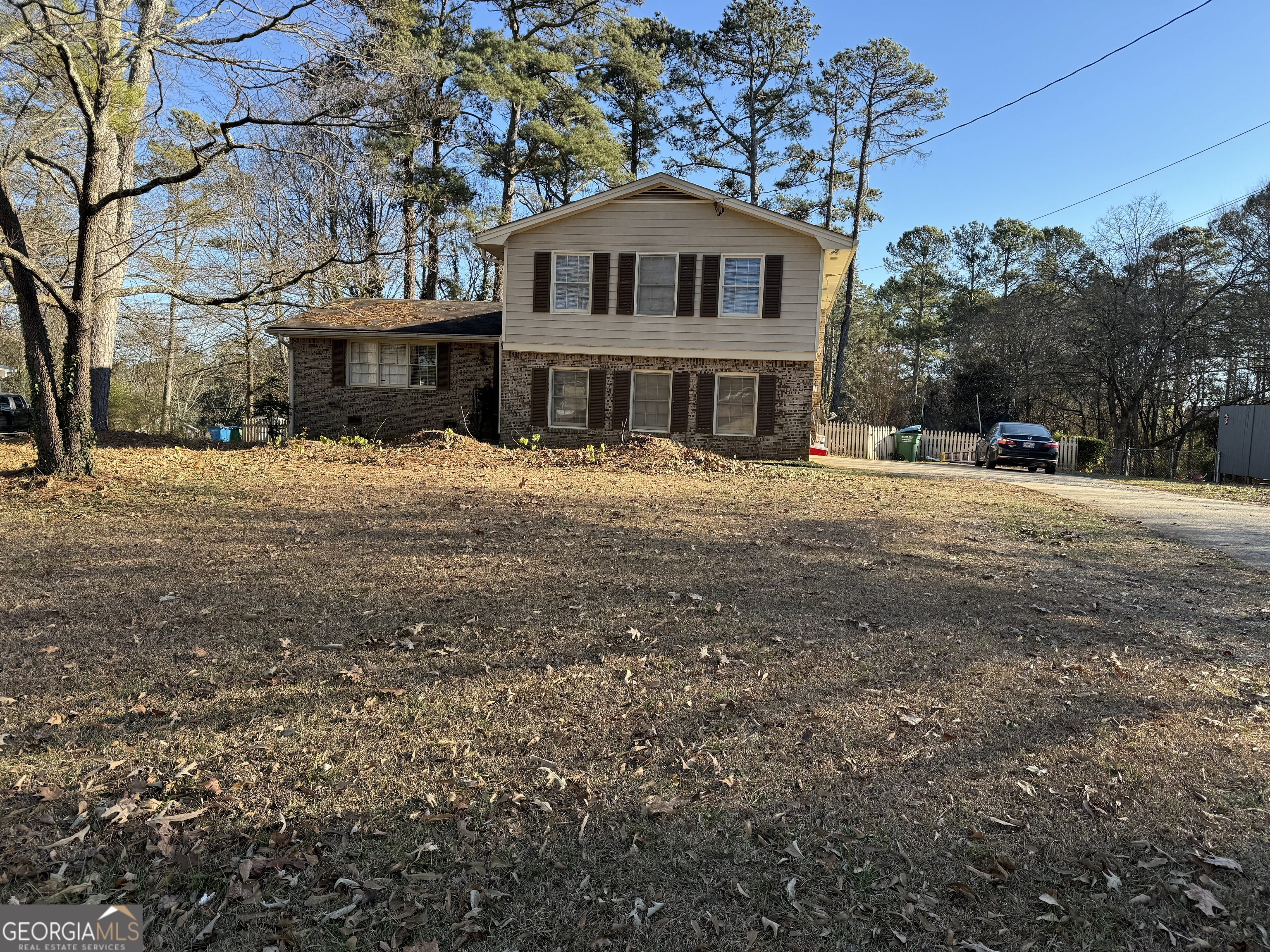 4722 Kenneth Drive Southwest Lilburn, GA 30047 - Photo 2 of 12 a front view of a house with a yard