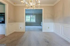 4722 Kenneth Drive Southwest Lilburn, GA 30047 - Photo 7 of 12 wooden floor in an empty room with a window