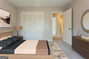 4722 Kenneth Drive Southwest Lilburn, GA 30047 - Photo 8 of 12 a bedroom with a bed and a table