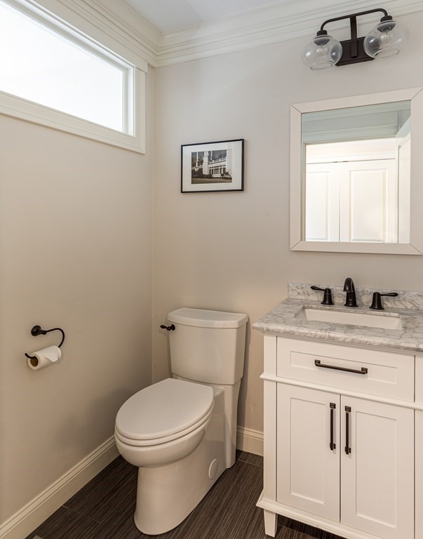 23 Pennock Road Ashland, MA 01721 - Photo 21 of 41 a bathroom with a granite countertop toilet sink and mirror
