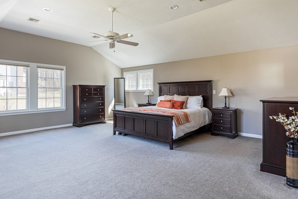 23 Pennock Road Ashland, MA 01721 - Photo 27 of 41 a bedroom with a bed and a chandelier