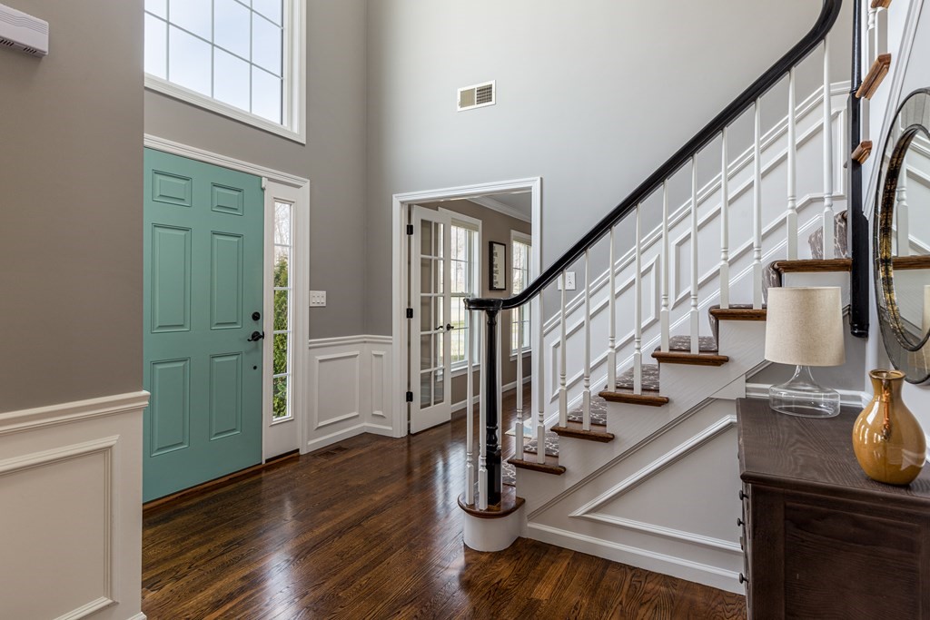 23 Pennock Road Ashland, MA 01721 - Photo 3 of 41 a view of entryway with wooden floor and stairs