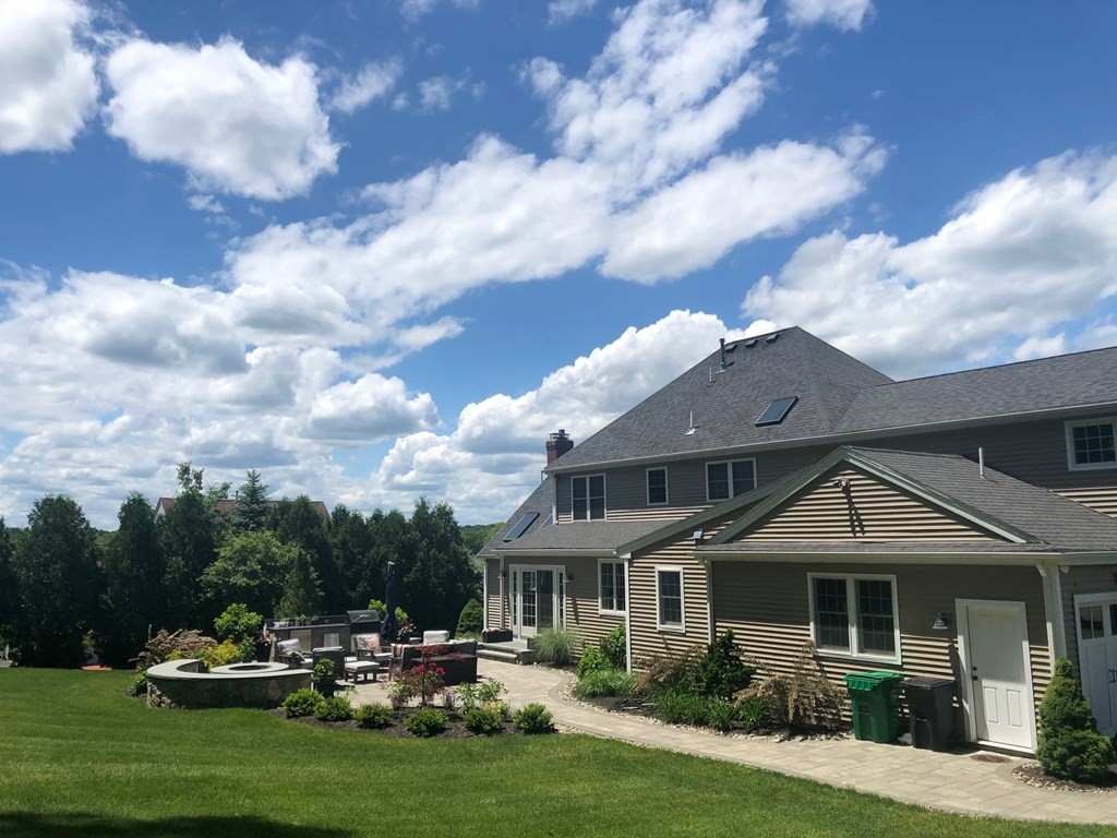 23 Pennock Road Ashland, MA 01721 - Photo 40 of 41 a front view of a house with a garden