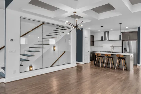 a view of kitchen with furniture and wooden floor