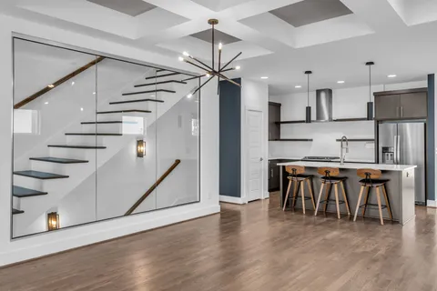 a view of kitchen with furniture and wooden floor