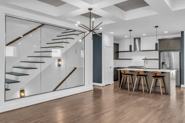 a view of kitchen with furniture and wooden floor