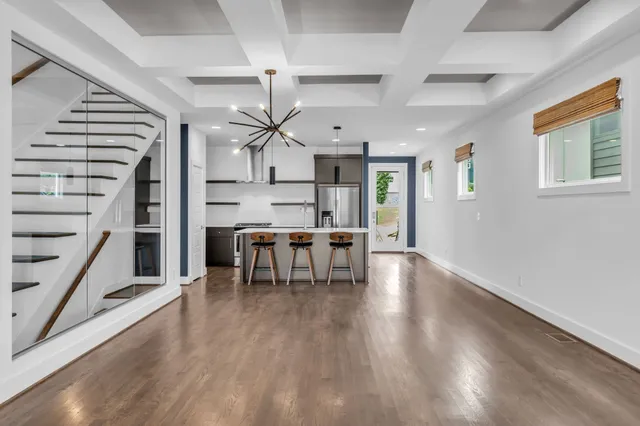 a view of dining room with furniture and wooden floor