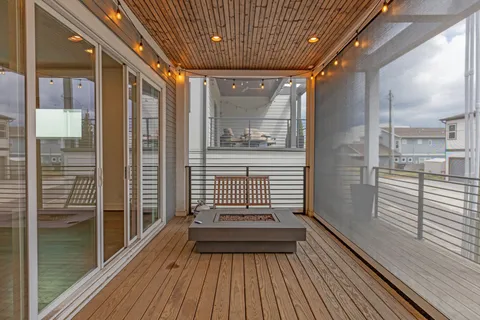 a view of outdoor space with wooden floor