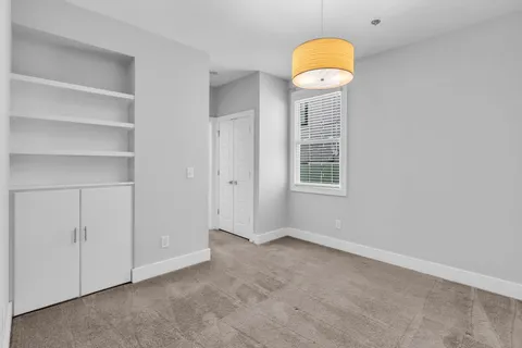 a view of a room that has a fan