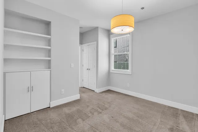 a view of a room that has a fan