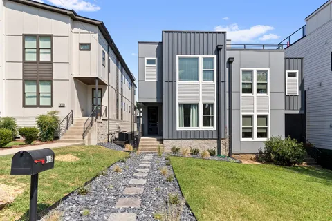 a front view of a house with garden