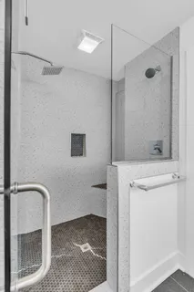 a bathroom with a shower and a sink