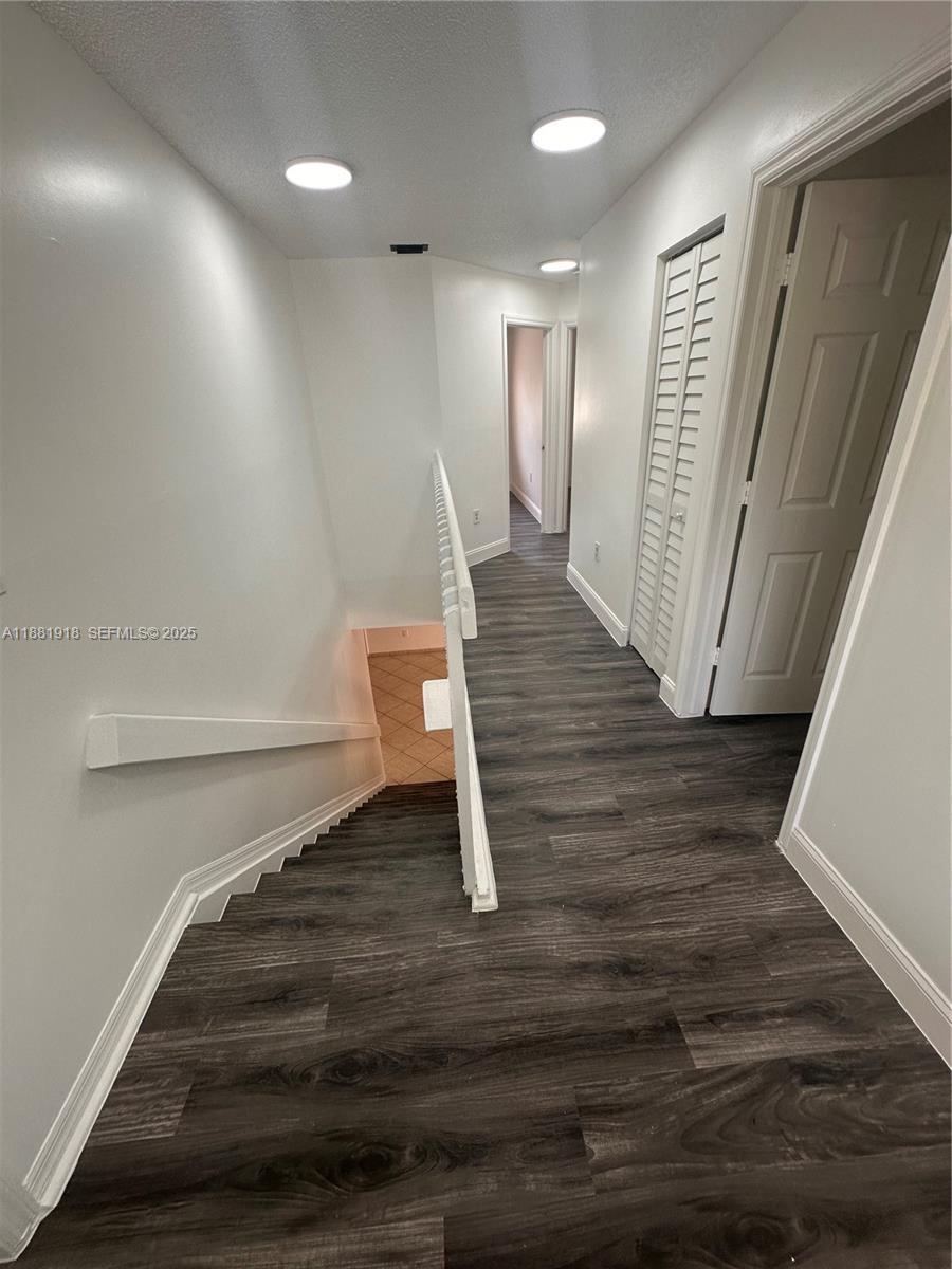 8950 Northwest 189th Terrace Hialeah, FL 33018 - Photo 15 of 42 a view of entryway with wooden floor