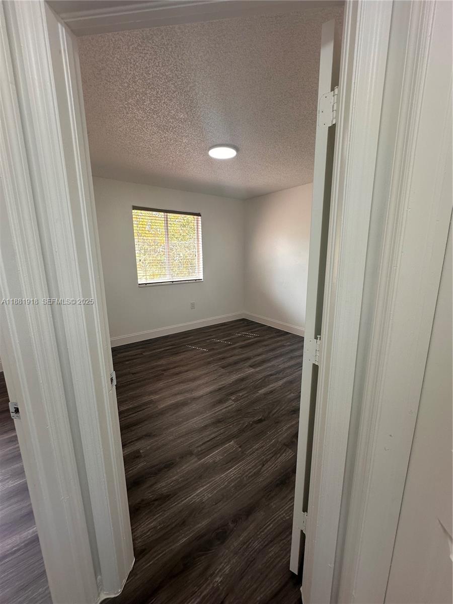 8950 Northwest 189th Terrace Hialeah, FL 33018 - Photo 27 of 42 a view of an empty room and window
