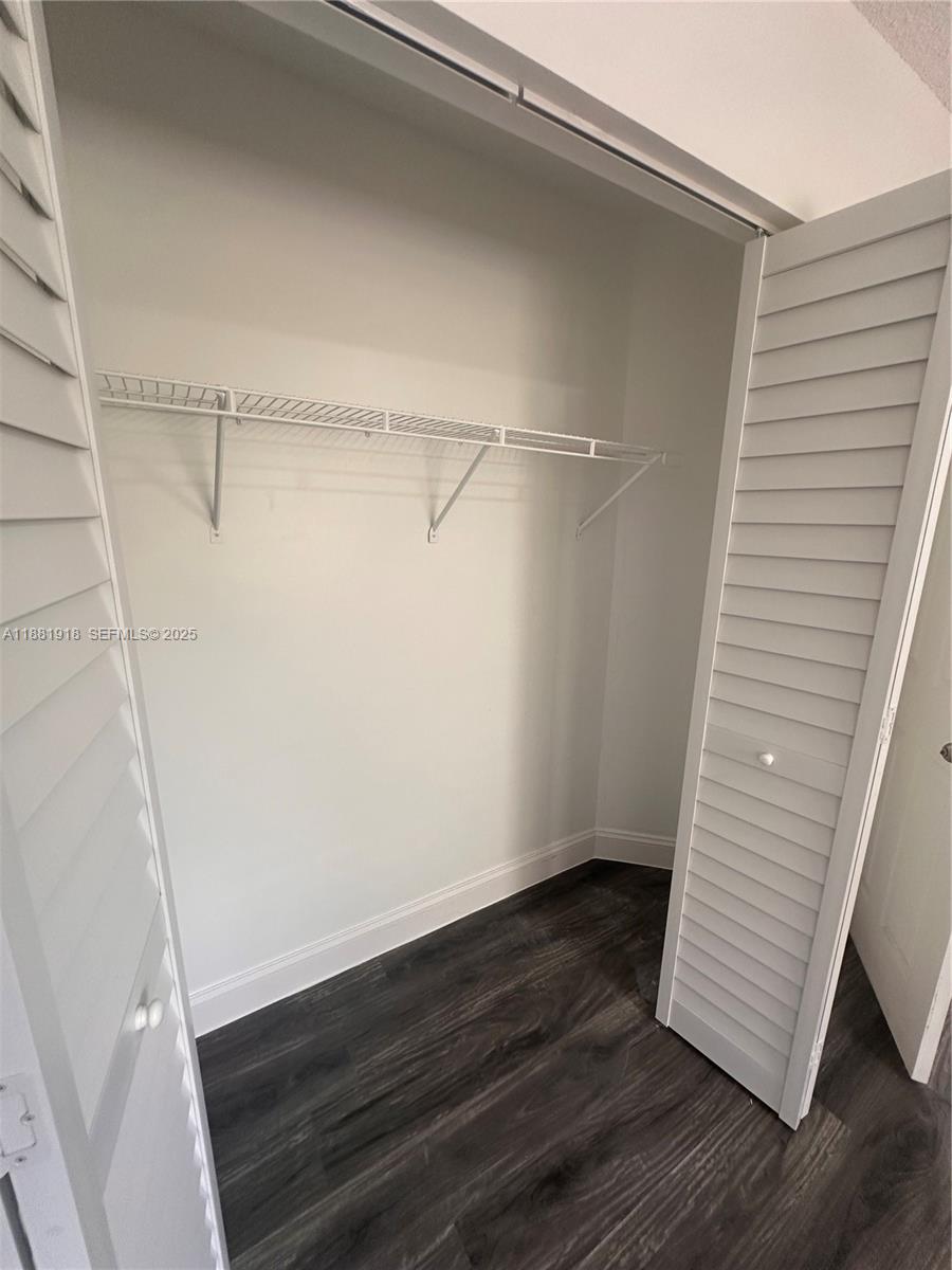 8950 Northwest 189th Terrace Hialeah, FL 33018 - Photo 29 of 42 a view of an empty walk in closet