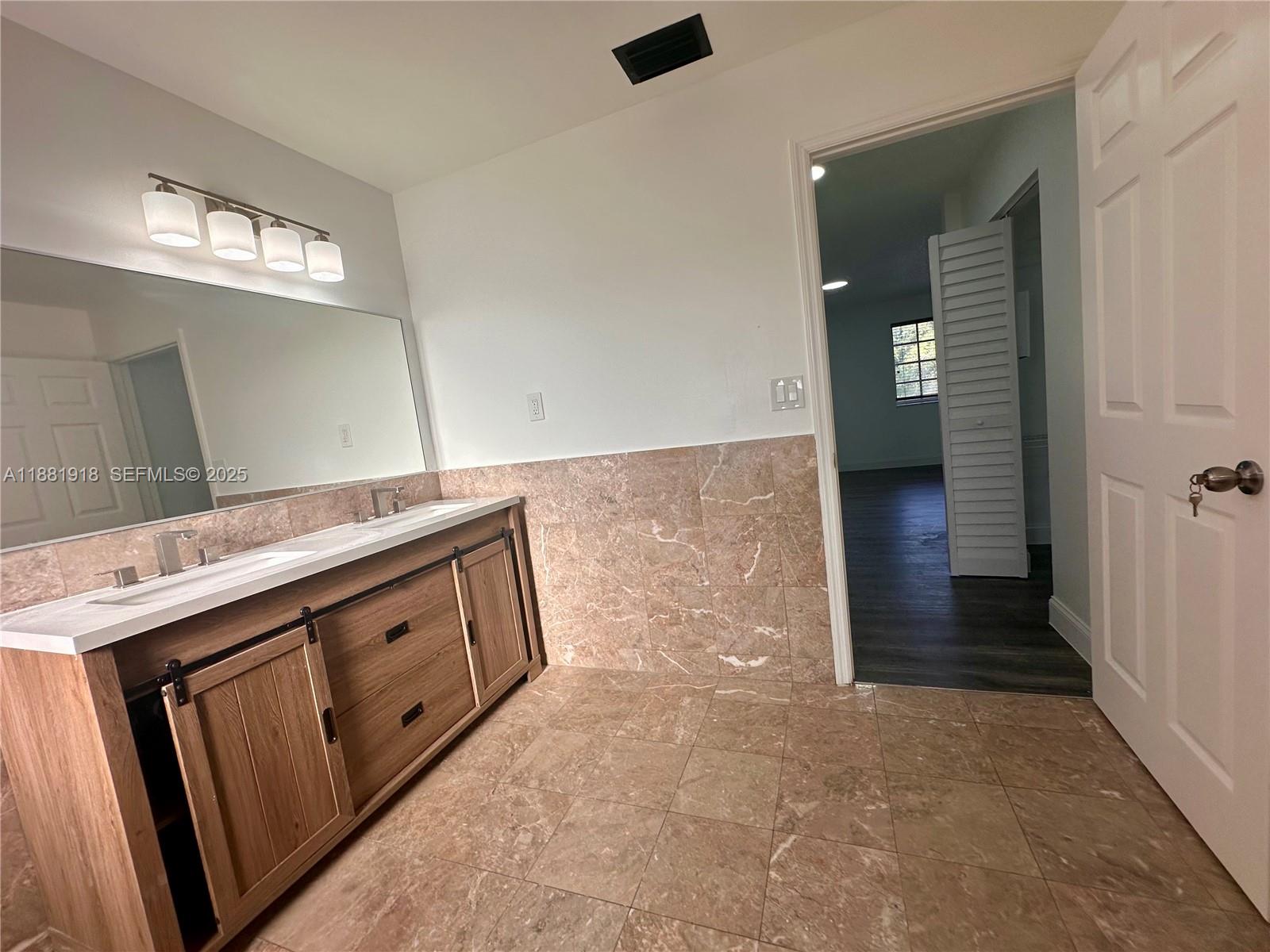 8950 Northwest 189th Terrace Hialeah, FL 33018 - Photo 34 of 42 a view of a hallway with washer and dryer