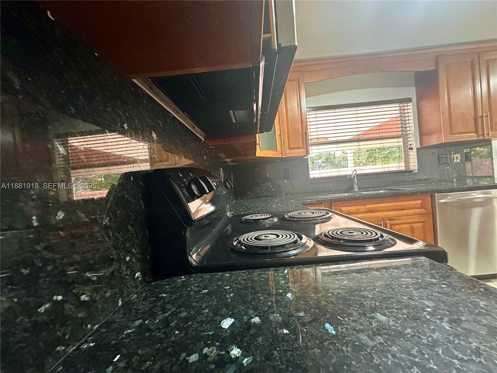 8950 Northwest 189th Terrace Hialeah, FL 33018 - Photo 4 of 42 a view of a livingroom with furniture and window