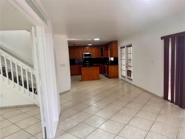 a view of a kitchen with a sink and cabinets