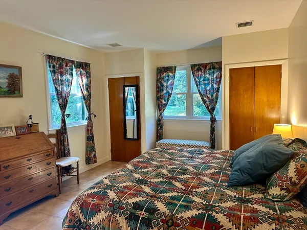 a bedroom with a bed and furniture