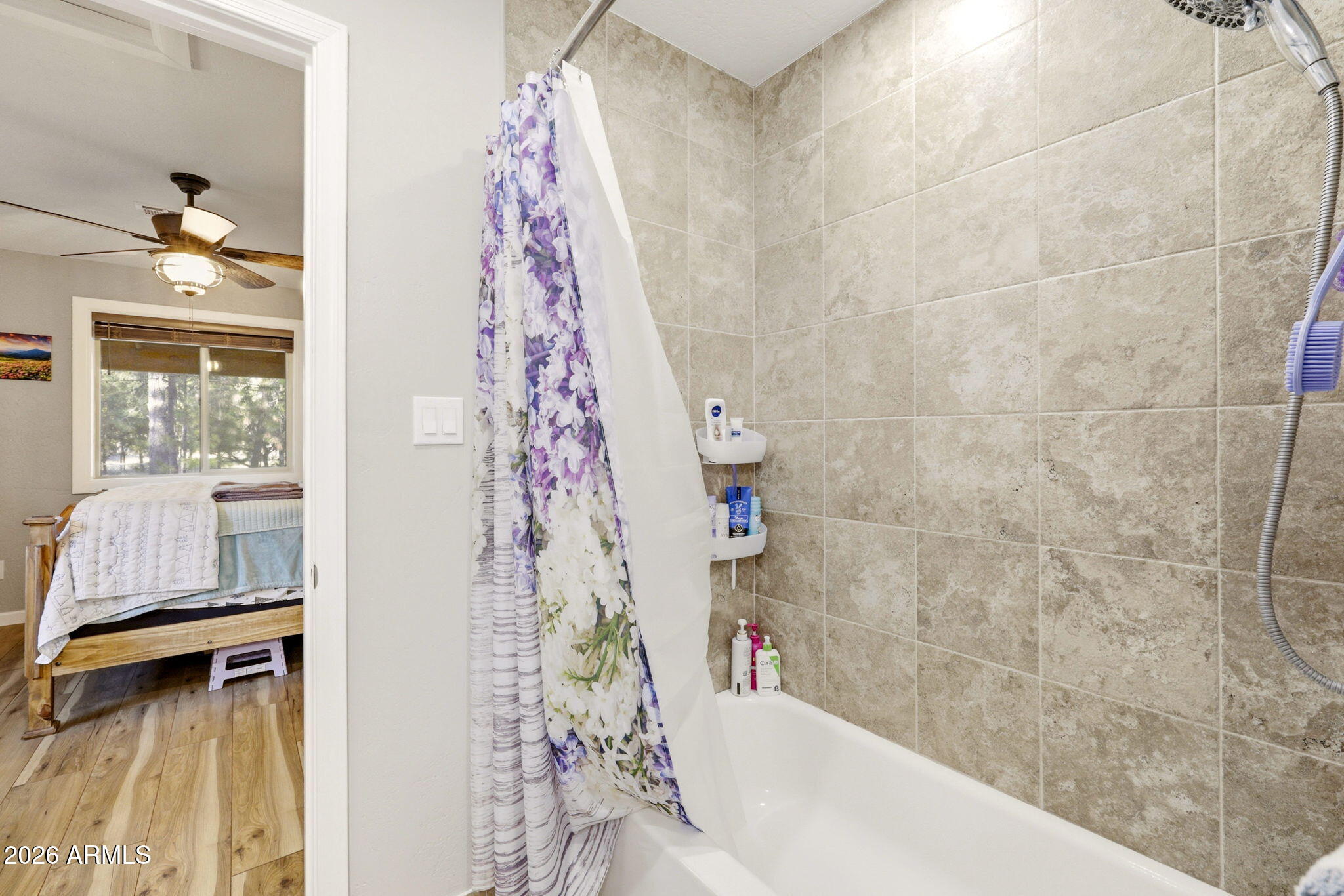 2900 Long Rifle Place Overgaard, AZ 85933 - Photo 15 of 35 a bathroom with a bathtub and shower