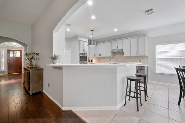 a bedroom with a bed a desk and chair