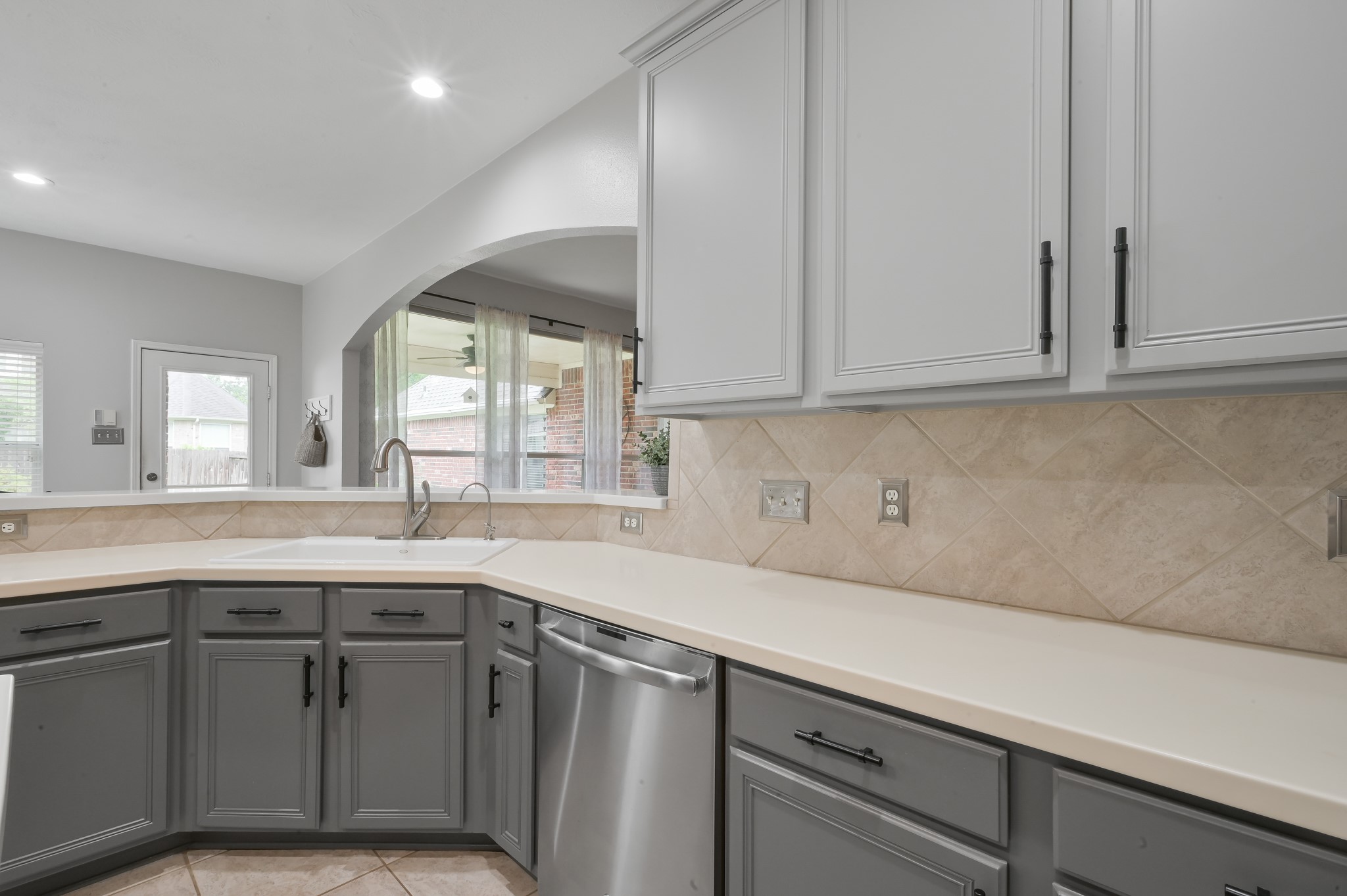 2 Westward Ridge Place The Woodlands, TX 77384 - Photo 17 of 43 An updated farmhouse sink, faucet, and new dishwasher make clean-up and organization a breeze