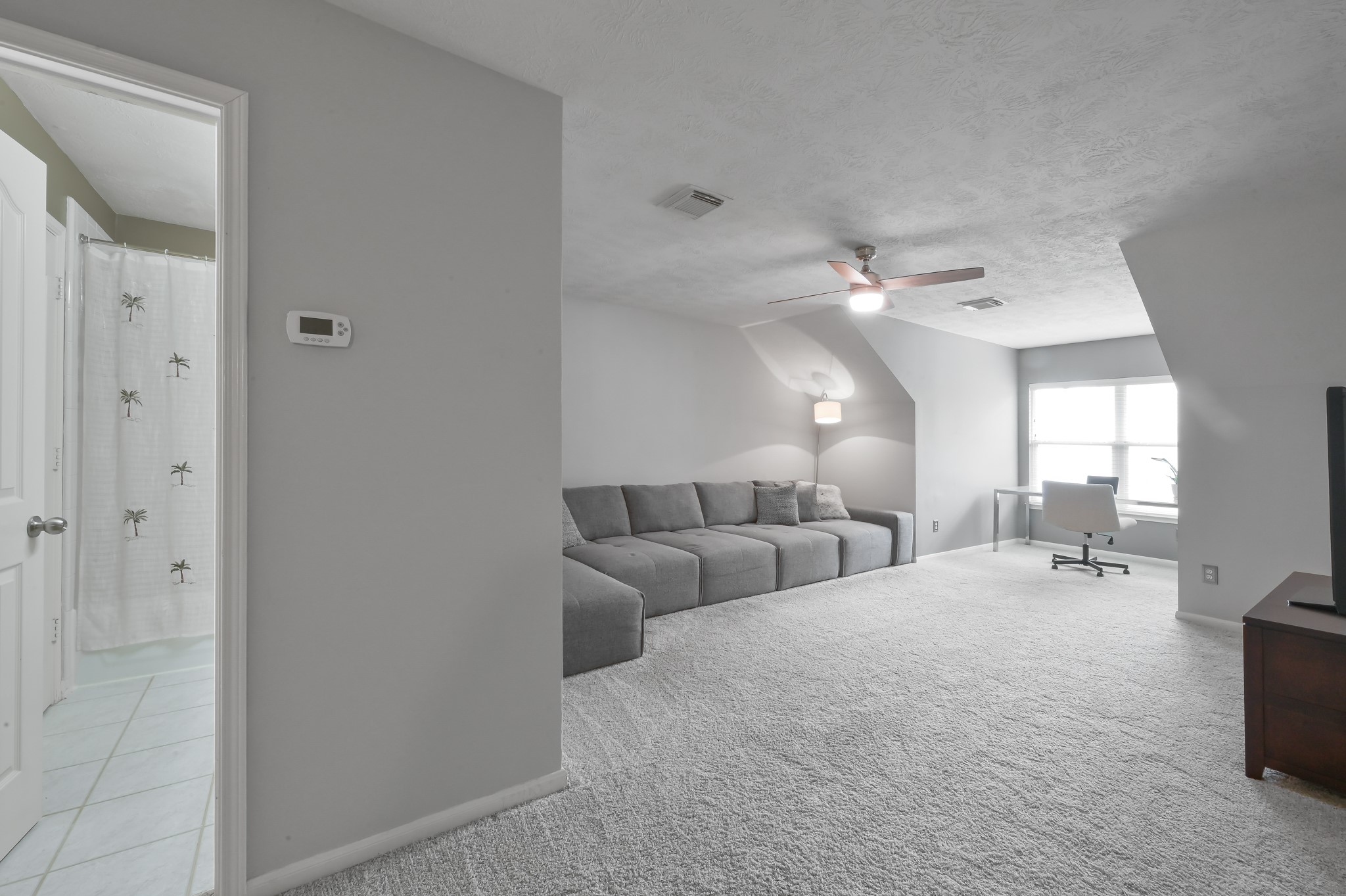 2 Westward Ridge Place The Woodlands, TX 77384 - Photo 32 of 43 This space offers the best of both worlds – a comfortable and private area for guests, while also functioning as a versatile entertainment space for the whole family.