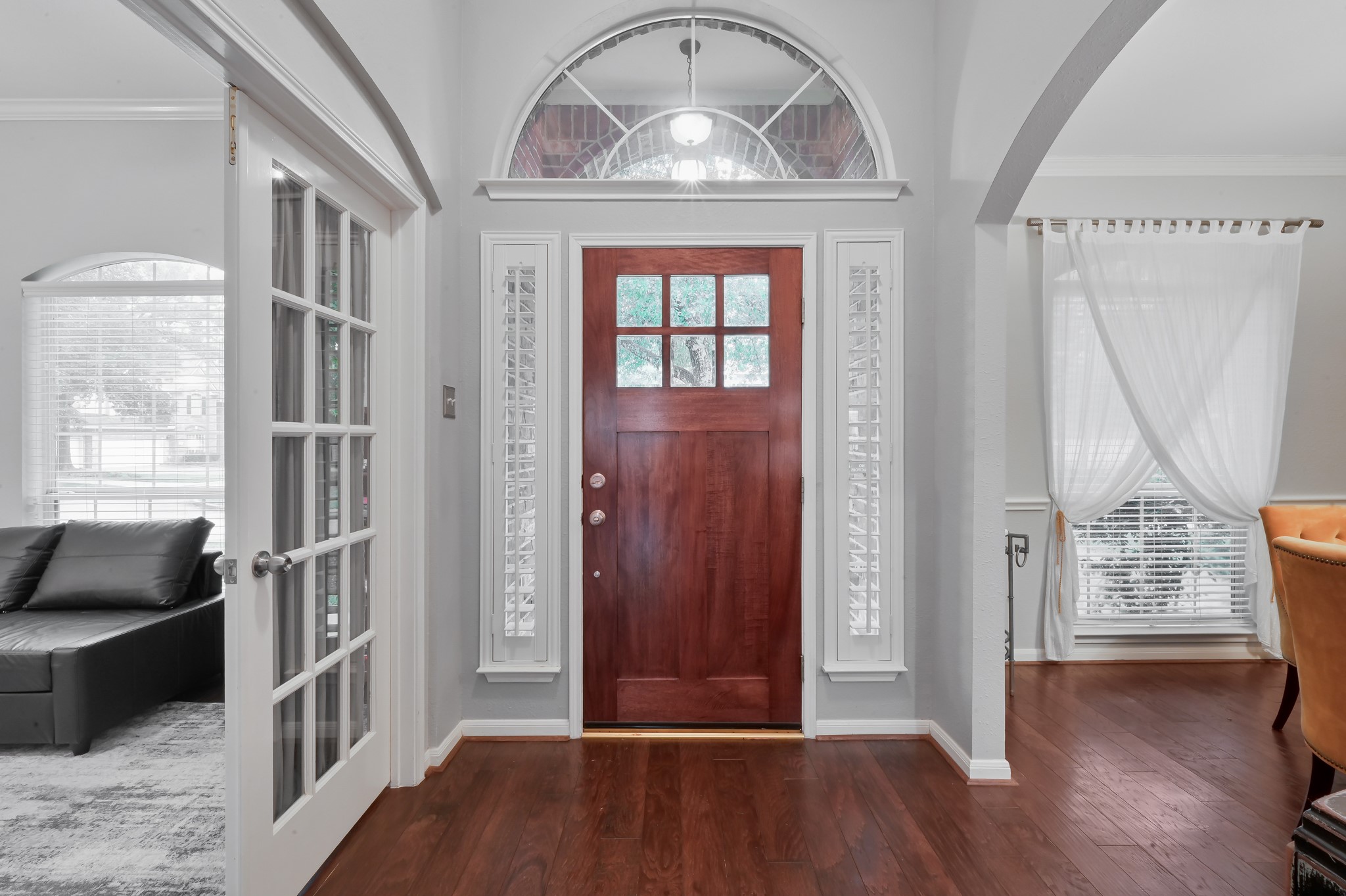 2 Westward Ridge Place The Woodlands, TX 77384 - Photo 6 of 43 NEW front door-A classic solid wood door with decorative glass panels and sidelights with wooden shutters