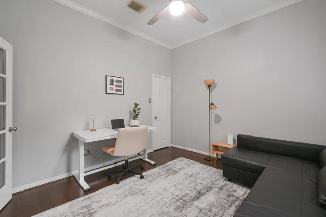 a living room with furniture a fireplace and a window