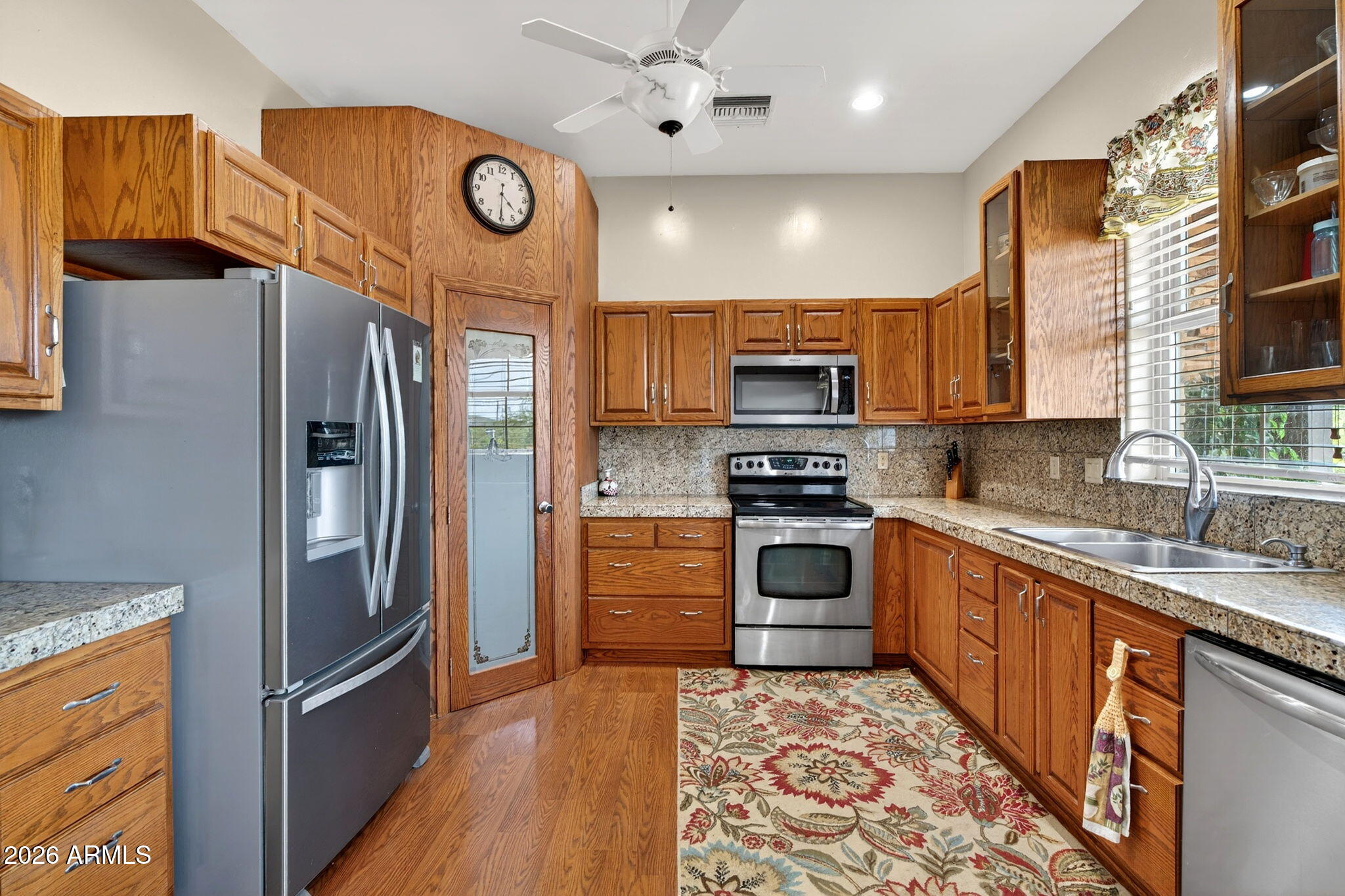 2929 West New River Road New River, AZ 85087 - Photo 10 of 53 a kitchen with stainless steel appliances granite countertop a refrigerator a oven a sink and dishwasher