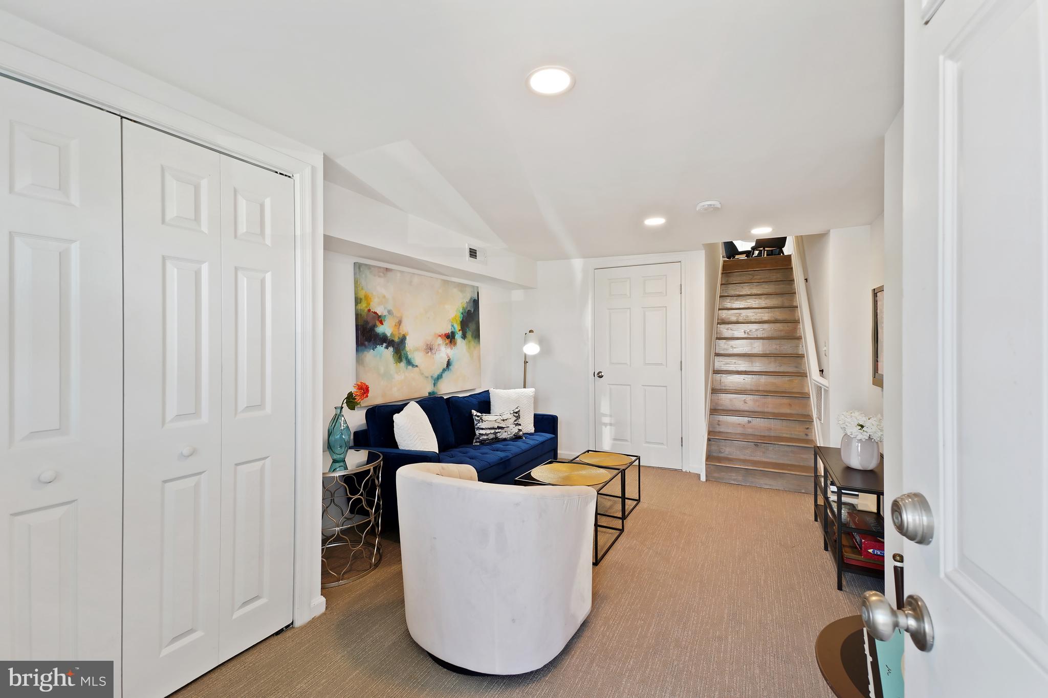 3731 Falls Road Baltimore, MD 21211 - Photo 14 of 30 a living room with furniture and a wooden door