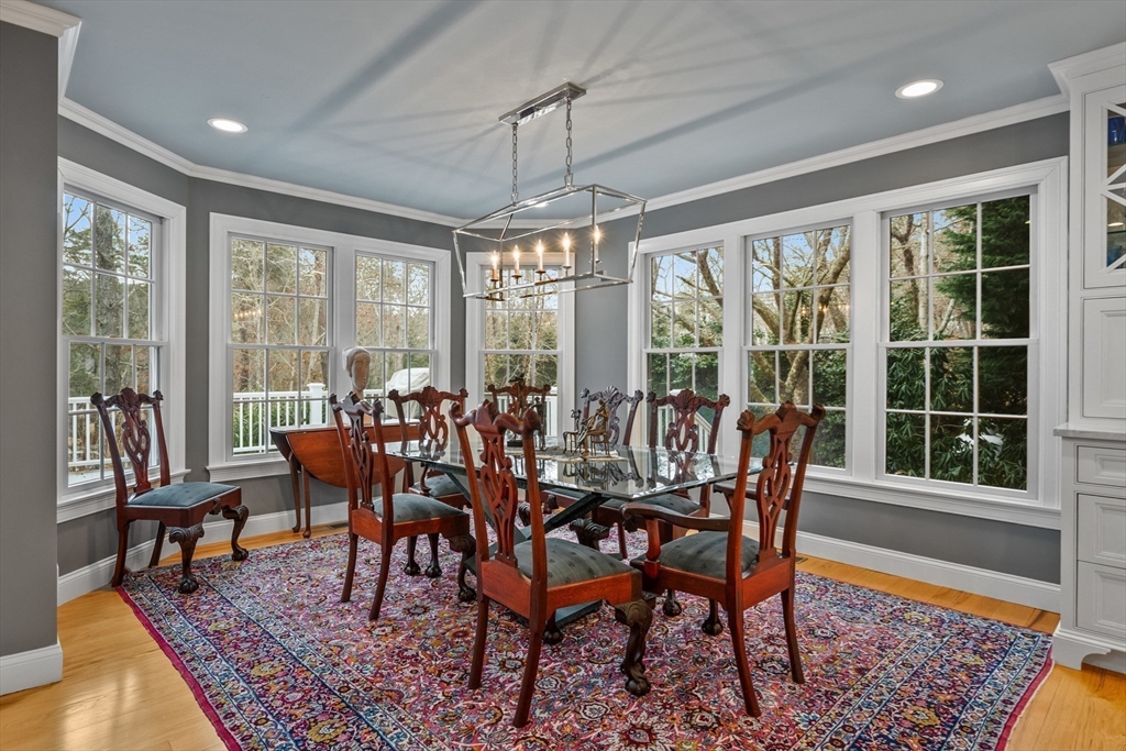 290 Old Comers Road Chatham, MA 02633 - Photo 11 of 40 a view of a dining room with furniture window and wooden floor