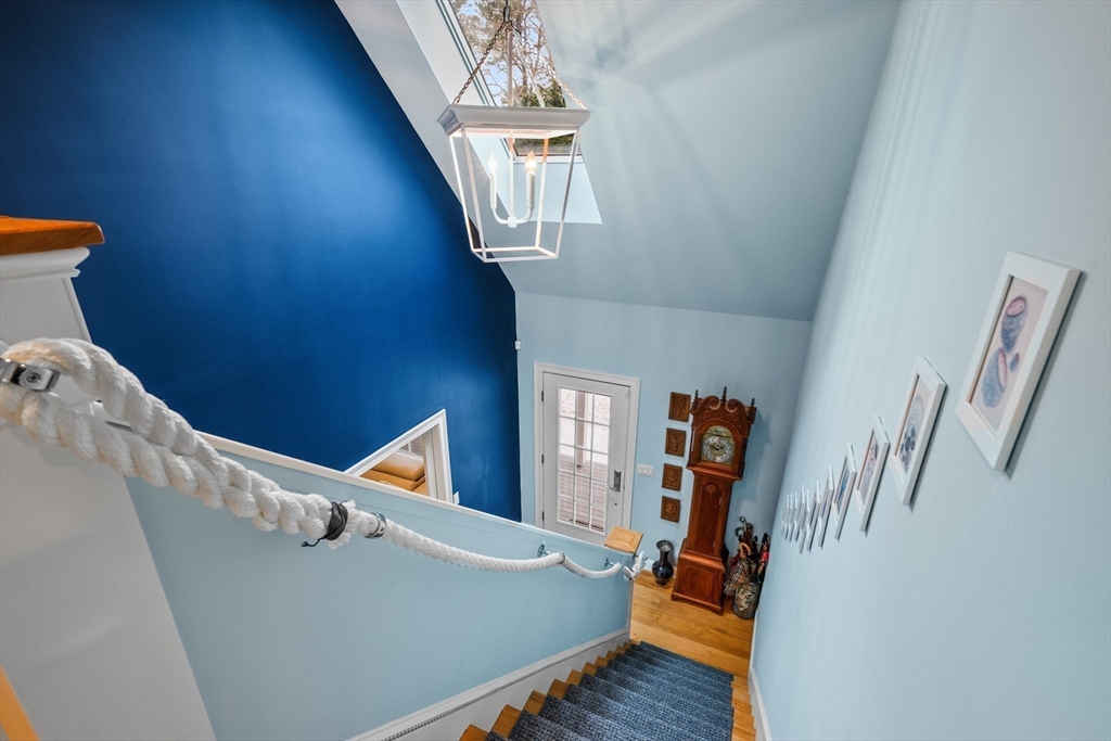 290 Old Comers Road Chatham, MA 02633 - Photo 19 of 40 wooden floor with windows and stairs
