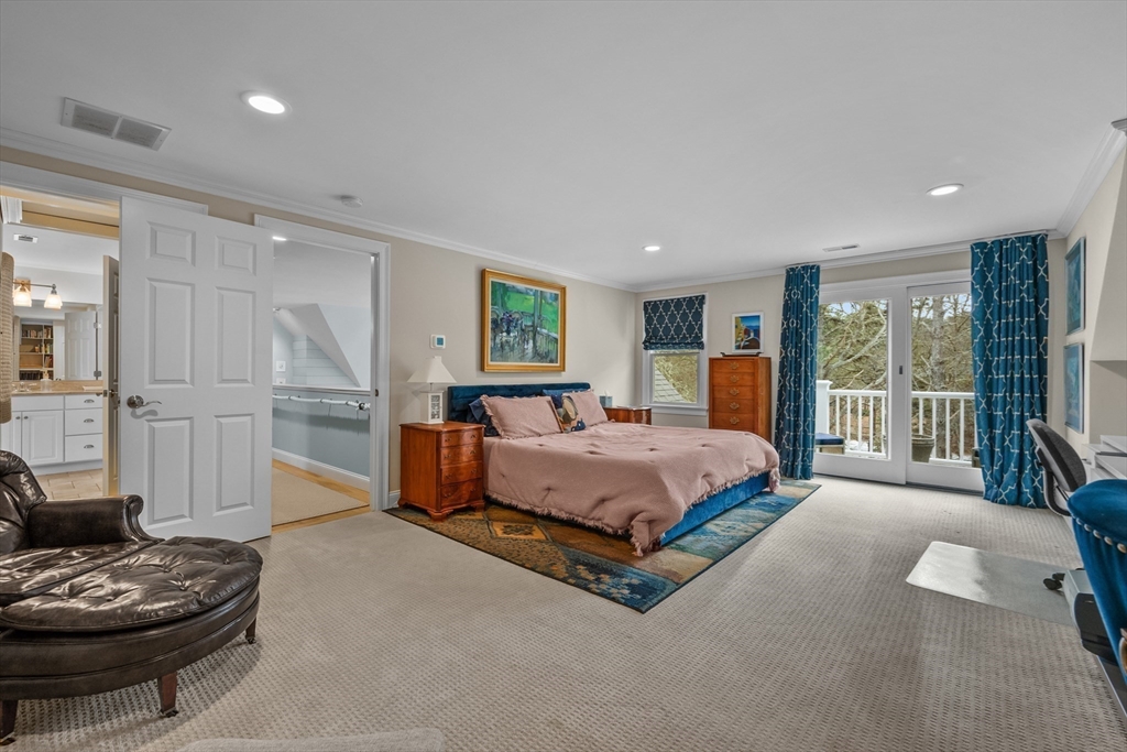290 Old Comers Road Chatham, MA 02633 - Photo 22 of 40 a spacious bedroom with a bed and a couch