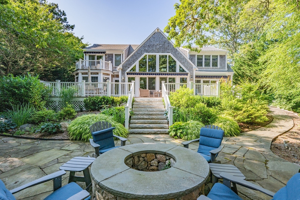 290 Old Comers Road Chatham, MA 02633 - Photo 26 of 40 a front view of house with yard and trees around