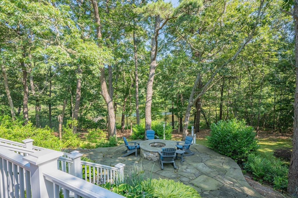 290 Old Comers Road Chatham, MA 02633 - Photo 29 of 40 a view of a patio with table and chairs and potted plants