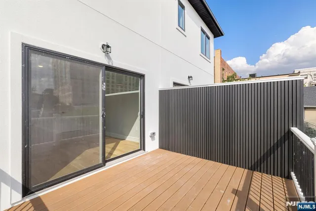 a balcony view with a glass door
