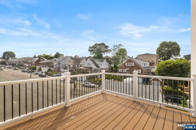 a view of a balcony with wooden floor