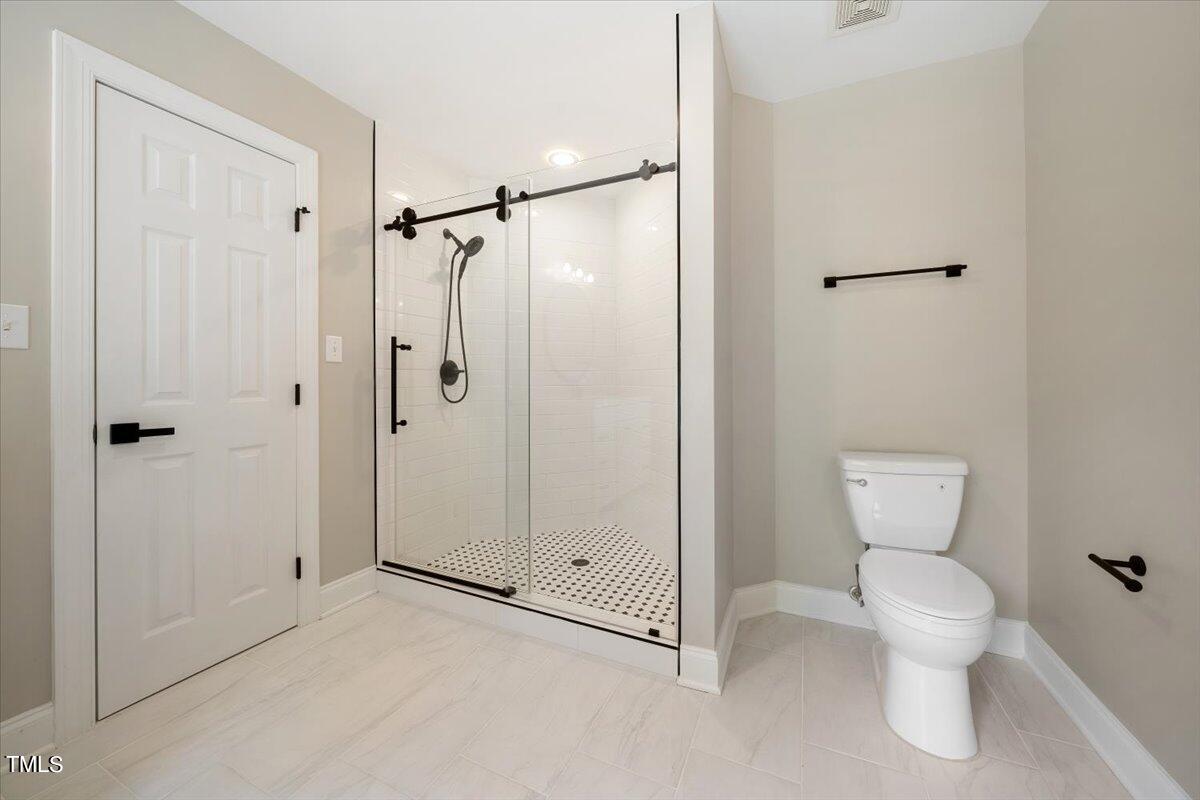 6300 Swallow Cove Lane Raleigh, NC 27614 - Photo 37 of 67 a bathroom that has a toilet in it