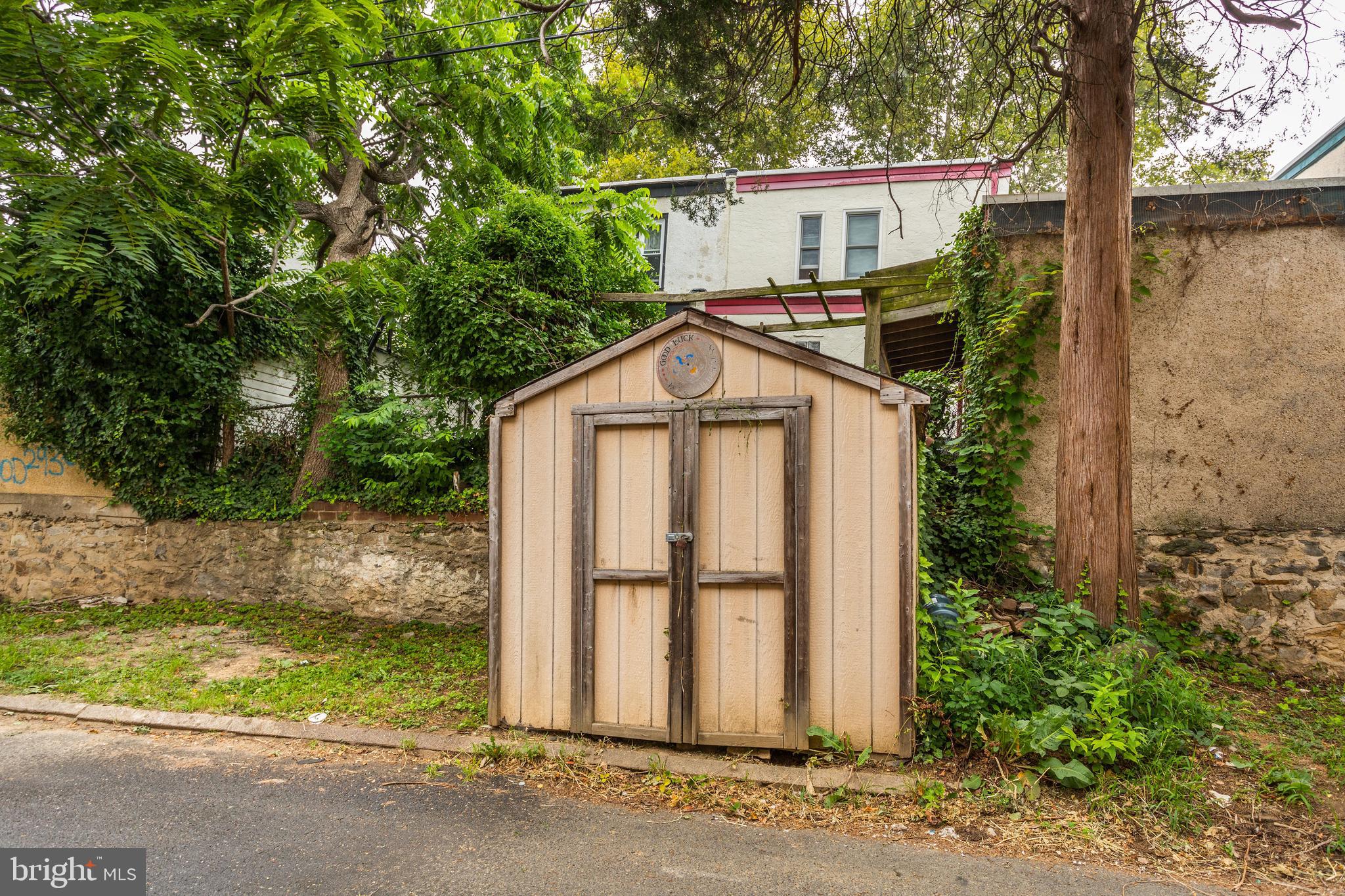 7249 Spruce Street Upper Darby, PA 19082 - Photo 28 of 30 a view of front of house with a yard and large tree