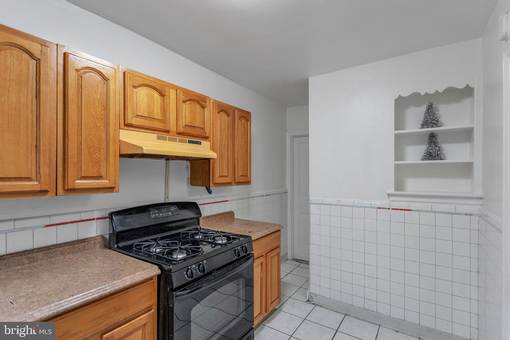 7249 Spruce Street Upper Darby, PA 19082 - Photo 10 of 30 a stove top oven sitting inside of a kitchen