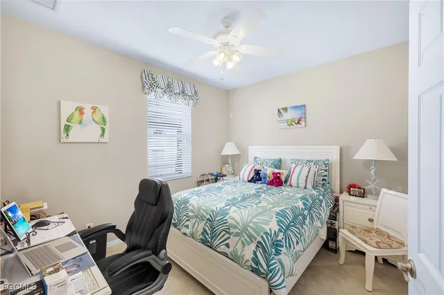 a bedroom with a bed and a desk