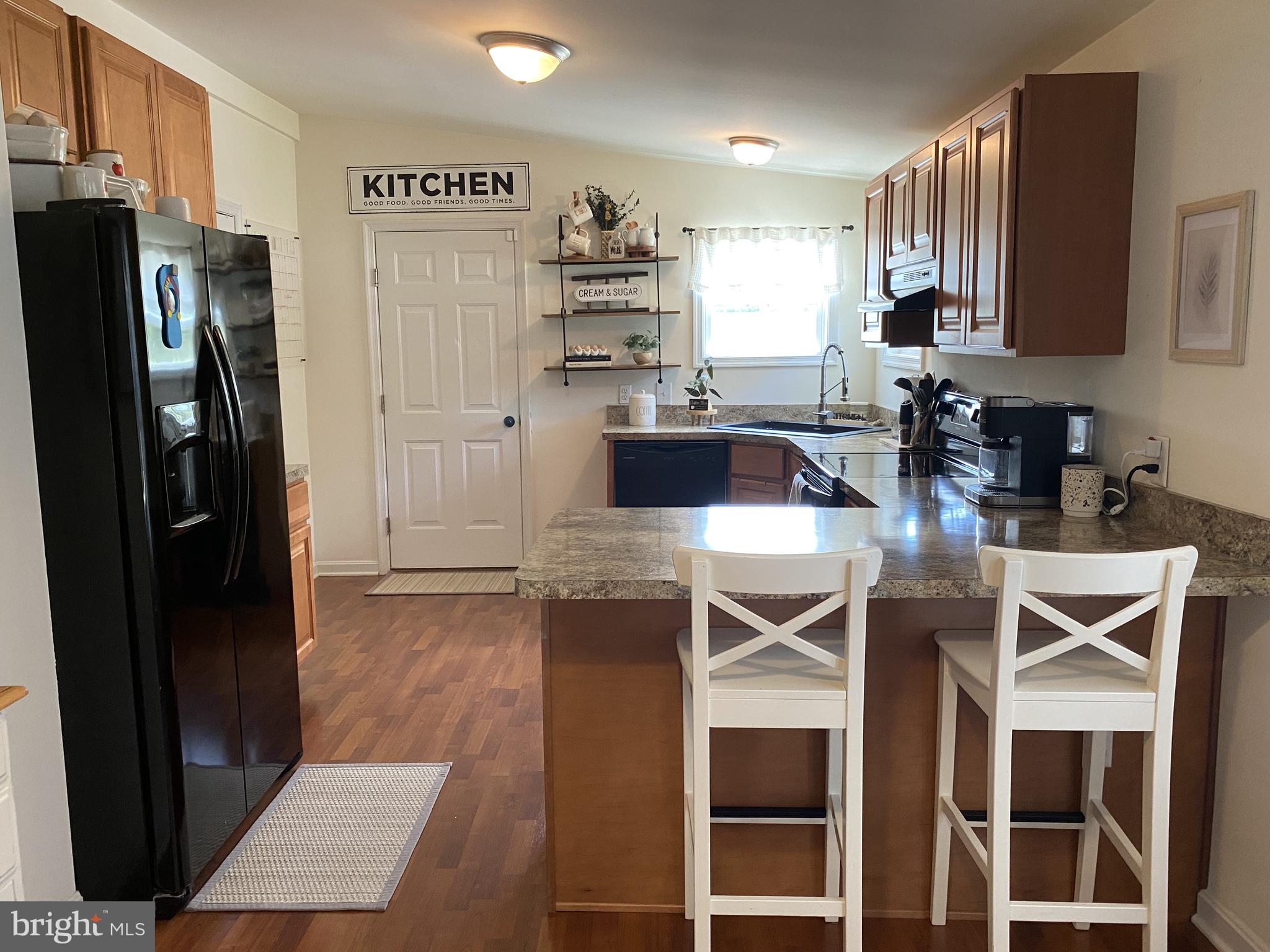 1336 Killens Pond Road Harrington, DE 19952 - Photo 8 of 29 Kitchen has bar stool seating