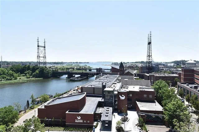 an aerial view of a city with lake view
