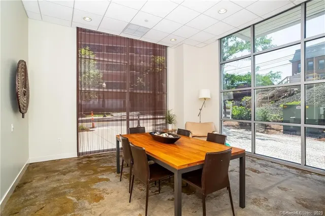 a view of a dining room with furniture window and outside view