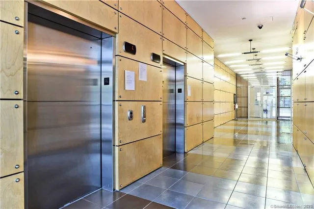 a bathroom with a shower and a mirror