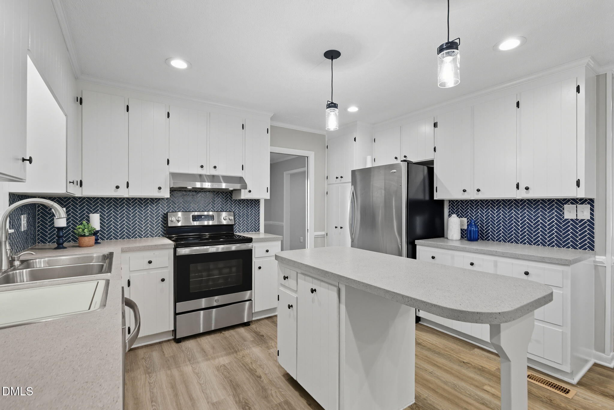 2238 Tarboro Road Youngsville, NC 27596 - Photo 14 of 41 a kitchen with a sink stainless steel appliances and white cabinets